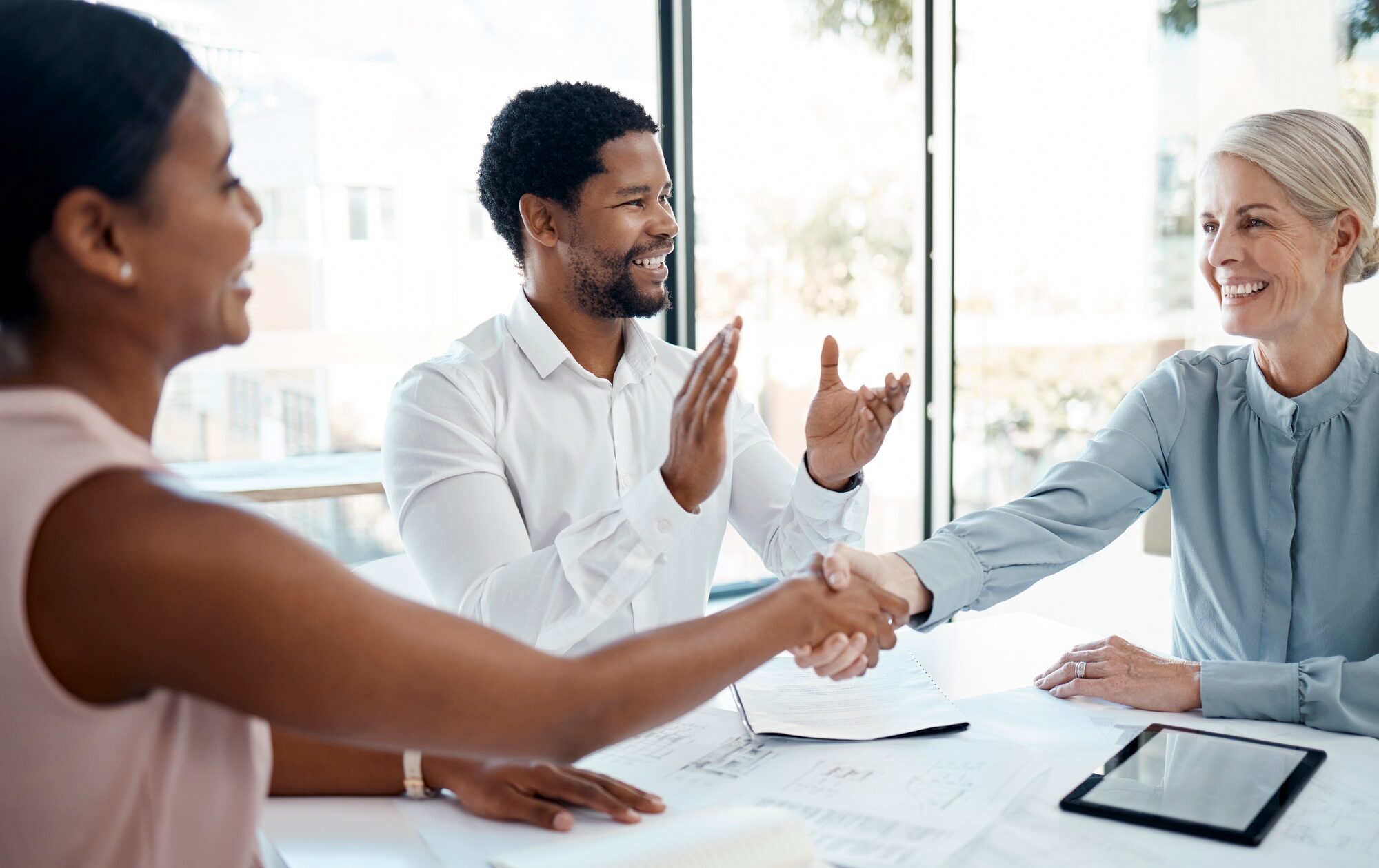 Handshake, diversity and congratulations business meeting success for b2b sales, architecture and b
