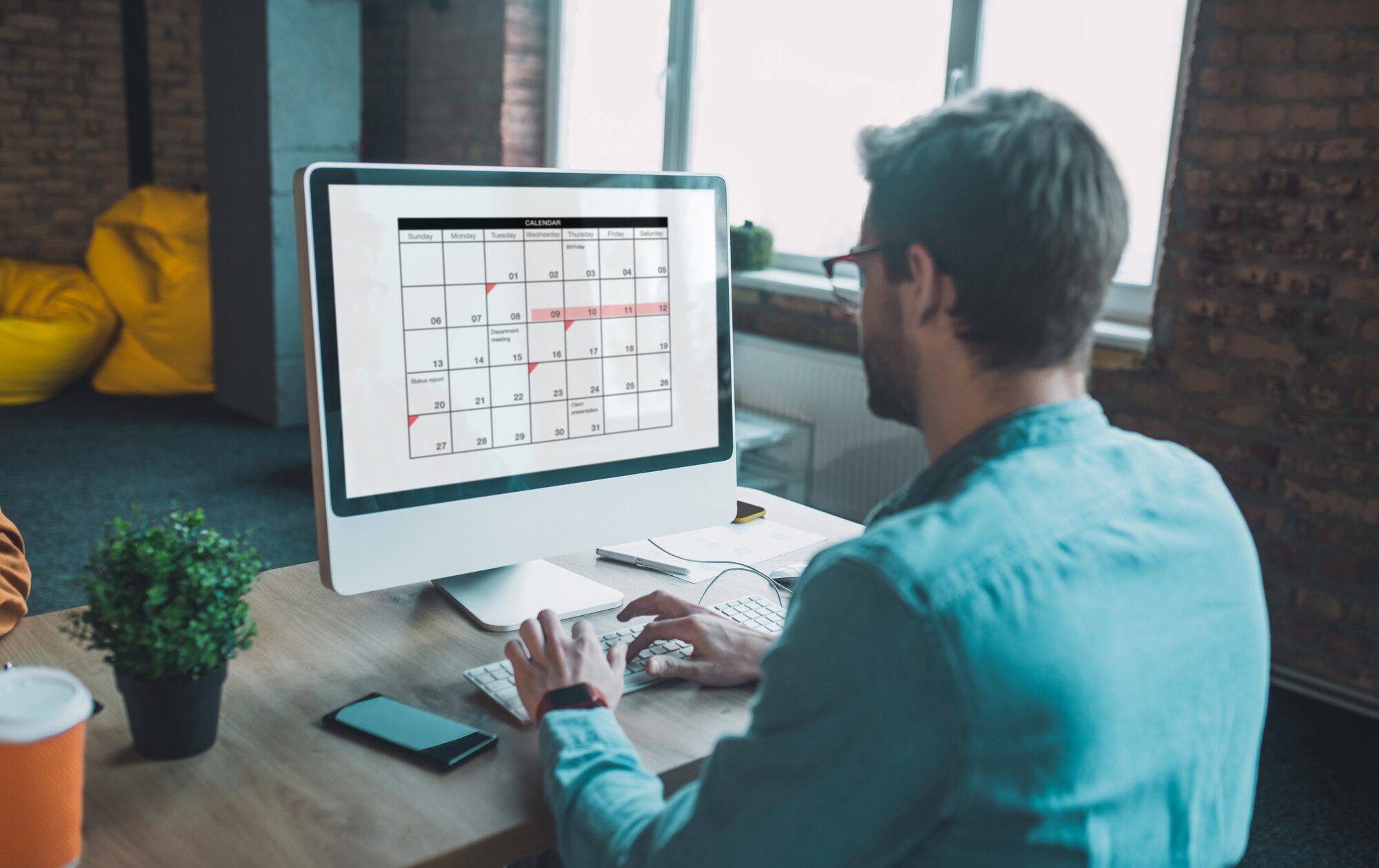 Nice smart man looking at the calendar