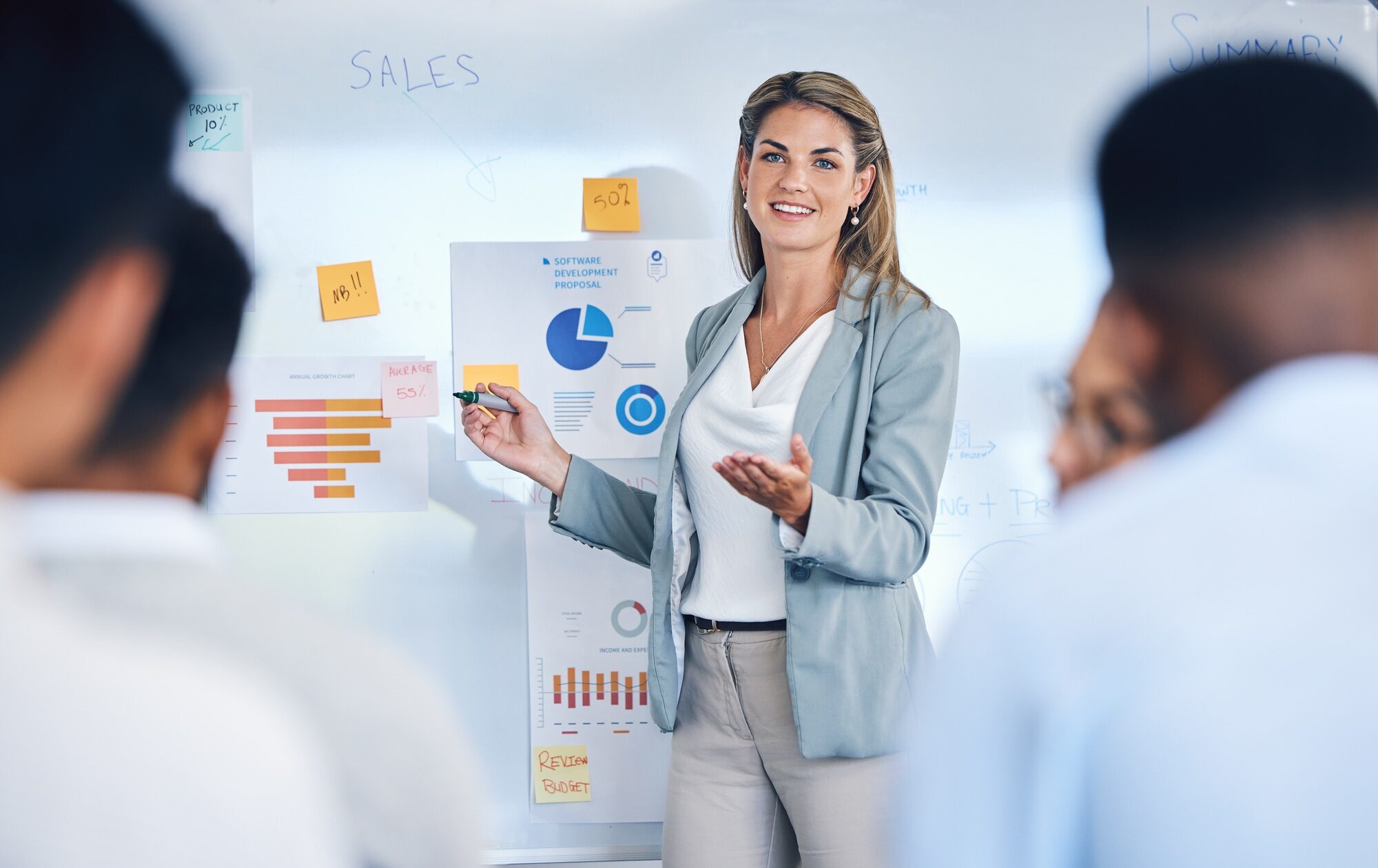 Sales, marketing and b2b strategy of business woman speaker giving a presentation to work crowd. Co