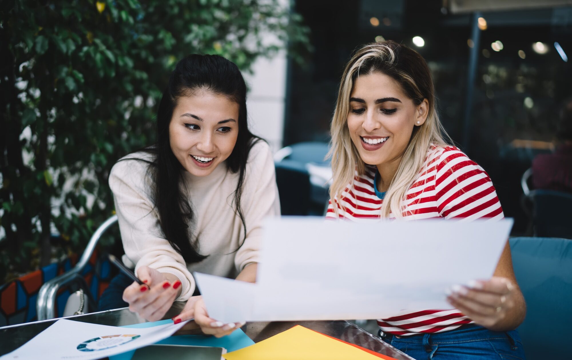 successful women doing university homework using informative reports for research